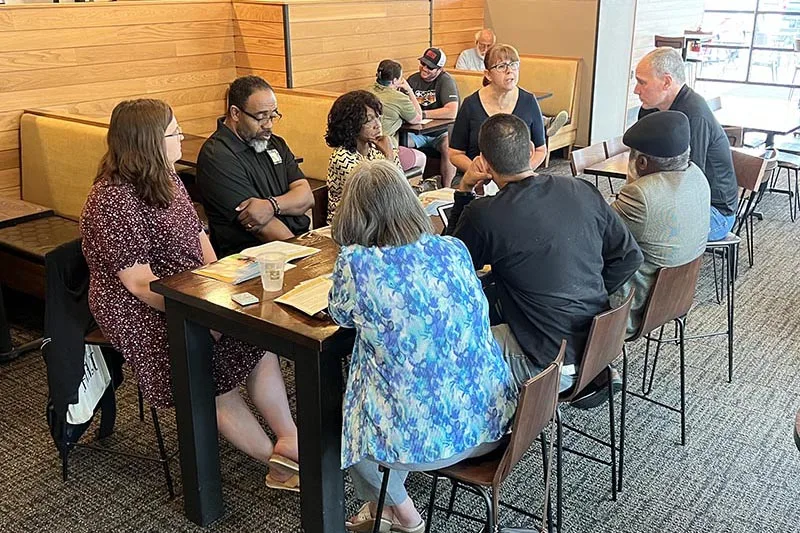 Pastors learn about Crossroads at an informational meeting at Panera Bread